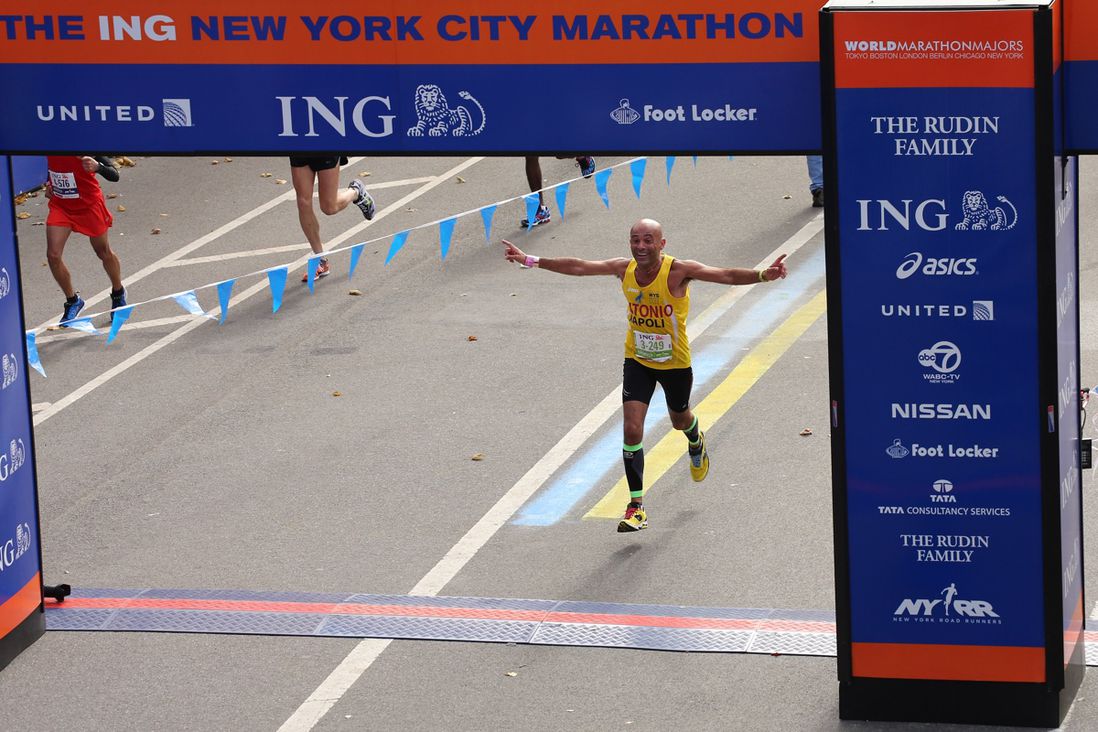 Italian runner Antonio D'Apuzzo  crosses the finish line in Central Park during the 2013 marathon. (<a href="http://www.gettyimages.com/license/186732983">Neilson Barnard</a>/Getty Images)